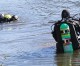 Dive team searches retention pond for object tossed by fleeing suspect